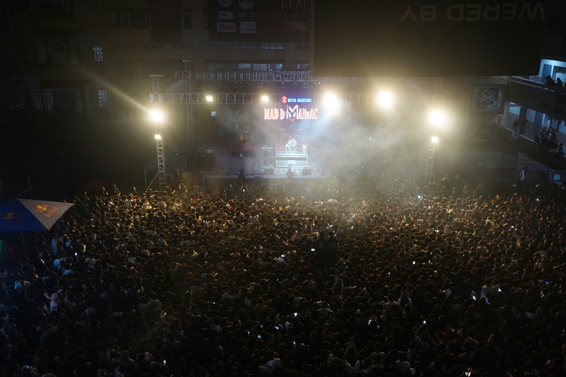 Night crowd gathered in front of stage lights